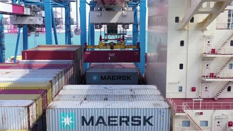 Port crane unloading a shipping Container off a Container ship. Stock Footage 141379736