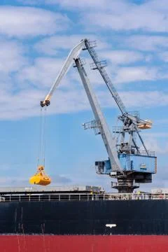 Port crane at work Stock Photos