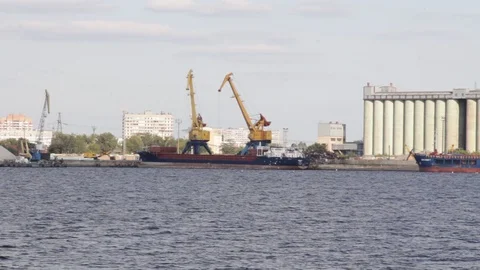 Port cranes load a cargo ship Stock Footage 94217246