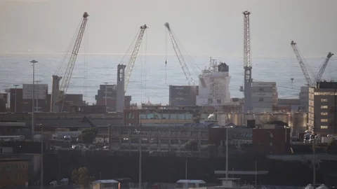 Port cranes moving on a container ship Stock Footage 126862588