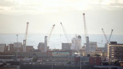 Port cranes moving on a container ship in Time Lapse Stock Footage 126880912