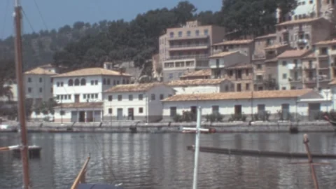 Port de Soller, Mallorca - 1977: Panoramic view of harbor and houses during 70s Stock Footage 308714942