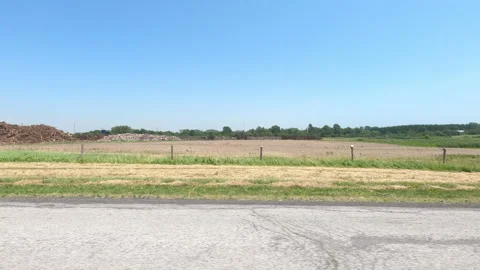 Port Dover, Can May 23 2026 POV side view driving plate farms and trees country Stock Footage 338297690