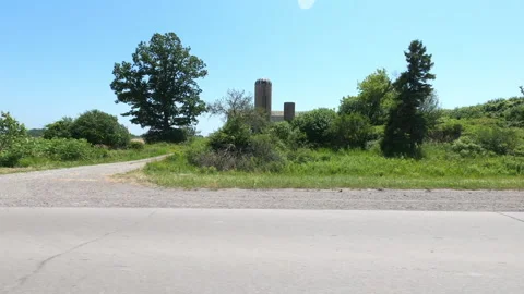 Port Dover, Can May 23 2026 POV side view driving plate farms and trees country Stock Footage 338302432