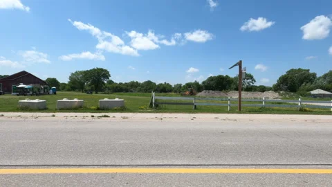 Port Dover, Can May 23 2026 POV side view driving plate farms and trees country Stock Footage 338304674