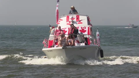 Port Dover, Canada July 1 2026 Canada day celebration with flag covered boats Stock Footage 338119775