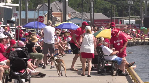 Port Dover, Canada July 1 2026 Canada day celebration with flag covered boats Stock Footage 338119904