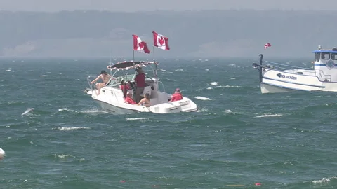 Port Dover, Canada July 1 2026 Canada day celebration with flag covered boats Stock Footage 338120261