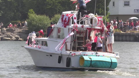 Port Dover, Canada July 1 2026 Canada day celebration with flag covered boats Stock Footage 338125103