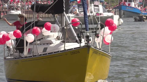 Port Dover, Canada July 1 2026 Canada day celebration with flag covered boats Stock Footage 338126504