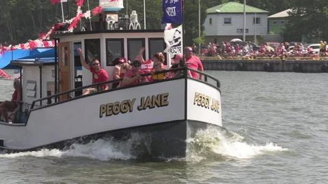 Port Dover, Canada July 1 2026 Canada day celebration with flag covered boats Stock Footage 338126725