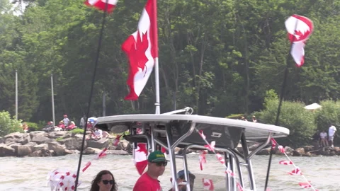Port Dover, Canada July 1 2026 Canada day celebration with flag covered boats Stock Footage 338130161