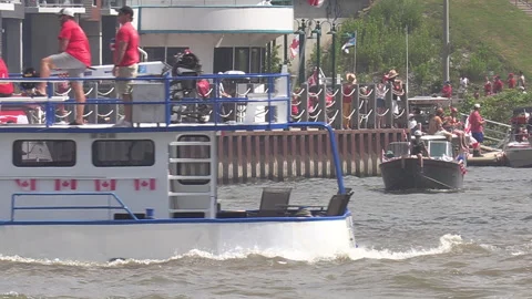 Port Dover, Canada July 1 2026 Canada day celebration with flag covered boats Stock Footage 338130459