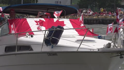 Port Dover, Canada July 1 2026 Canada day celebration with flag covered boats Stock Footage 338130879