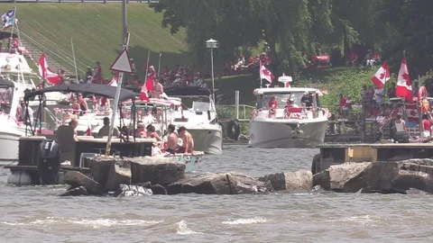 Port Dover, Canada July 1 2026 Canada day celebration with flag covered boats Stock Footage 338131219