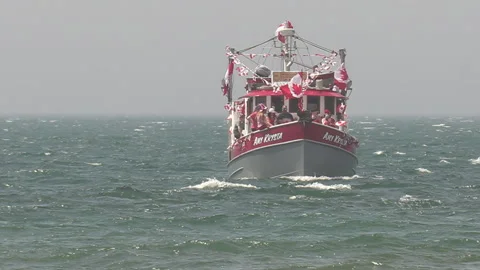 Port Dover, Canada July 1 2026 Canada day celebration with flag covered boats Stock Footage 338131222