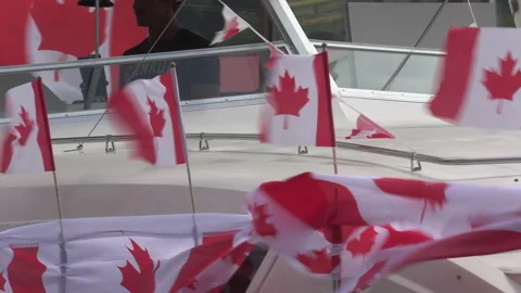 Port Dover, Canada July 1 2026 Canada day celebration with flag covered boats Stock Footage 338131642