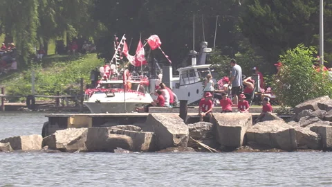 Port Dover, Canada July 1 2026 Canada day celebration with flag covered boats Stock Footage 338132361