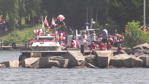 Port Dover, Canada July 1 2026 Canada day celebration with flag covered boats Stock Footage 338133013