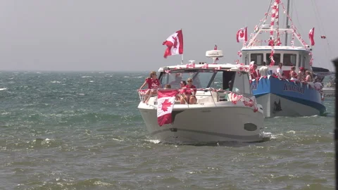 Port Dover, Canada July 1 2026 Canada day celebration with flag covered boats Stock Footage 338133066