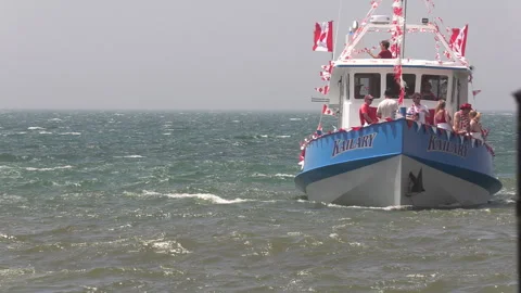 Port Dover, Canada July 1 2026 Canada day celebration with flag covered boats Stock Footage 338133170
