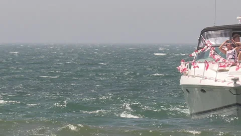 Port Dover, Canada July 1 2026 Canada day celebration with flag covered boats Stock Footage 338133625