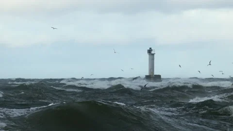 Port entry lighthouse as seen over stormy sea 스톡 동영상 138744627