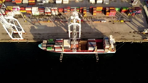 Port full of stacked shipping containers in Vigo Spain handled by cranes. Stock Footage 166990932