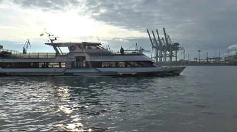 Port of Hamburg - Ferry in backlight overtaking in front of the crane Stock Footage 33730261