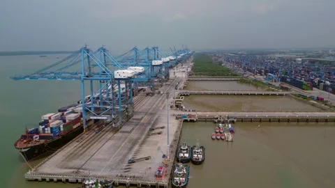 Port Klang with container ships loading cargo. Smooth aerial view drone Stock Footage 344601867