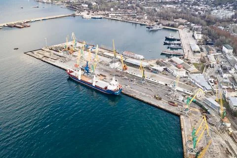 Port with a large cargo ship Stock Photos