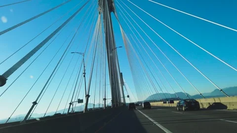 The Port Mann Bridge is a 10-lane cable-stayed bridge in British Columbia. Stock Footage 282554595