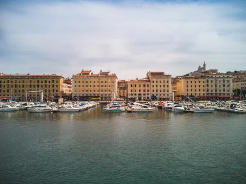 Port of Marseille, view of boats and typical buildings over the water Stock Photos