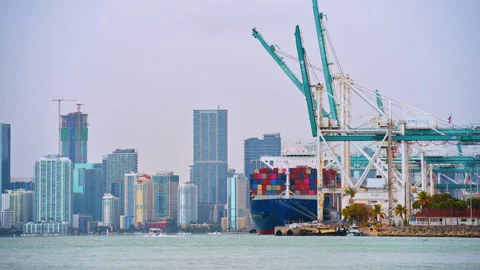 Port of Miami with a large ship loaded with colorful containers. Mist covers the Stock Footage 334216460