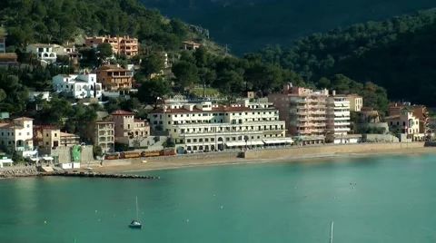 Port Soller, train driving along the promenade Stock Footage 48761825