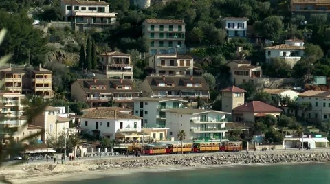 Port Soller, train driving along the promenade Stock Footage 48762936