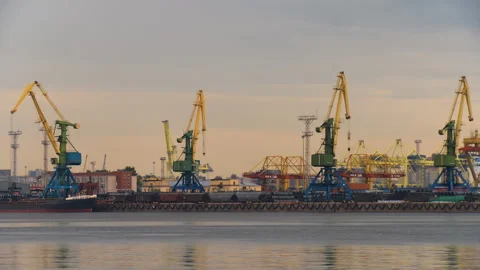 The port tug floats against the backdrop of the port infrastructure Stock Footage 92206734