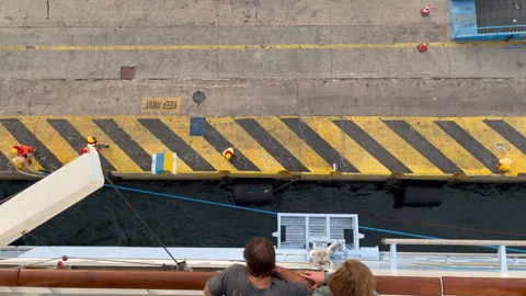 Port Workers Secure Voyager of the Seas to Dock Stock Footage 312789684