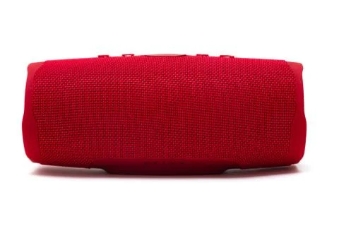 Portable bluetooth red speaker isolated on white background. Stock Photos