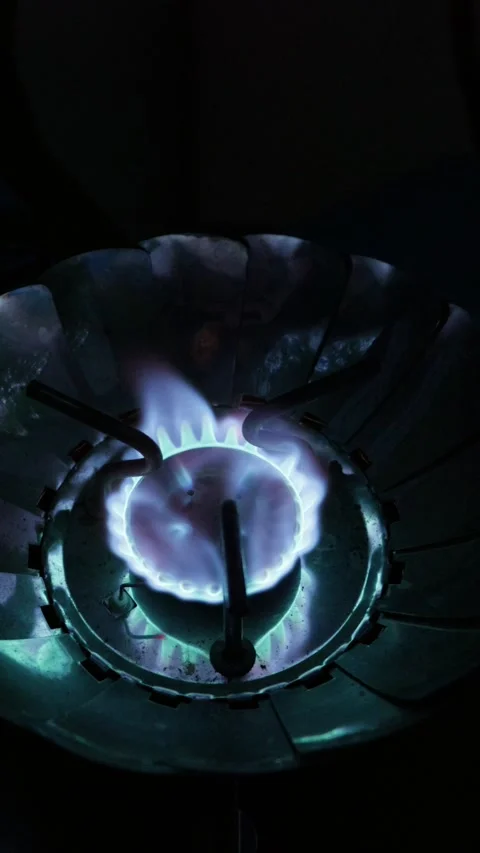 Portable Camping Gas Burner Igniting Bright Blue Flame in Darkness Stock Footage 341997076