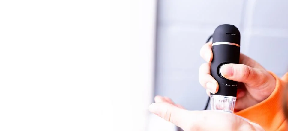 A portable computer and a microscope. computer microscope, manual microscope Stock Photos