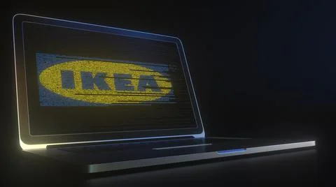 Portable computer with the logo of IKEA made with code strings, editorial Stock Illustration