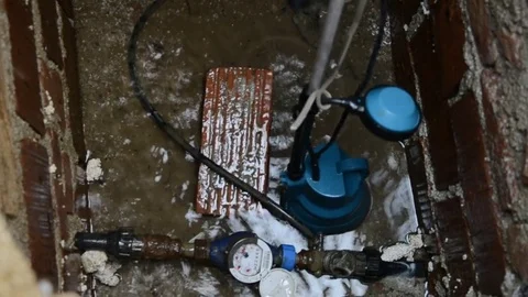 Portable deep sump pump for remove water from a sump pit, swimming pool Stock Footage 70331012