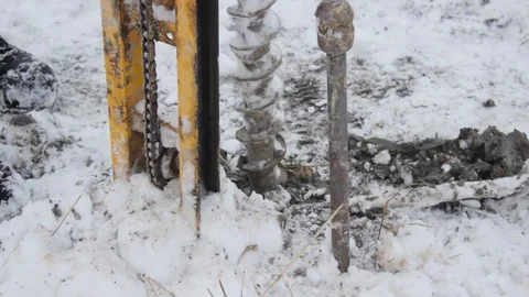 Portable drilling rig in action. Workers produces drilling to test soil. Stock Footage 72376018