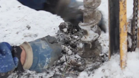 Portable drilling rig in action. Workers produces drilling to test soil. Video stock 72376085