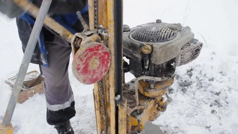 Portable drilling rig in action. Workers produces drilling to test soil. Stock Footage 72376130