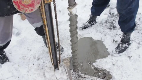 Portable drilling rig in action. Workers produces drilling to test soil. Video stock 72376139