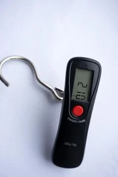 Portable electronic scale isolated over white background . Stock Photos