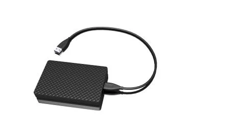 Portable external hard disk drive with USB cable on white background. Stock Photos