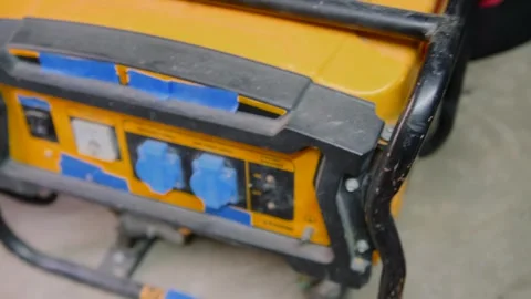 Portable gasoline generator in close-up providing backup electric power for Stock Footage 334862150